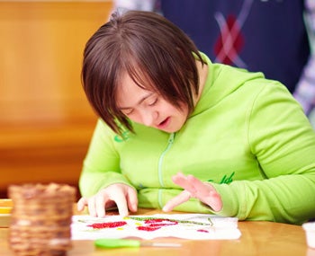 A woman in a green shirt